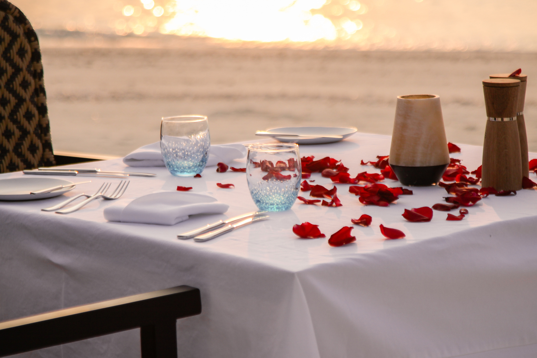 Romantic candle light dinner on the beach