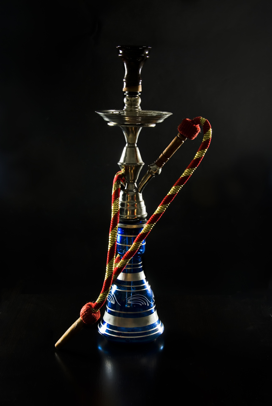 Sheesha pipe on display with dark background